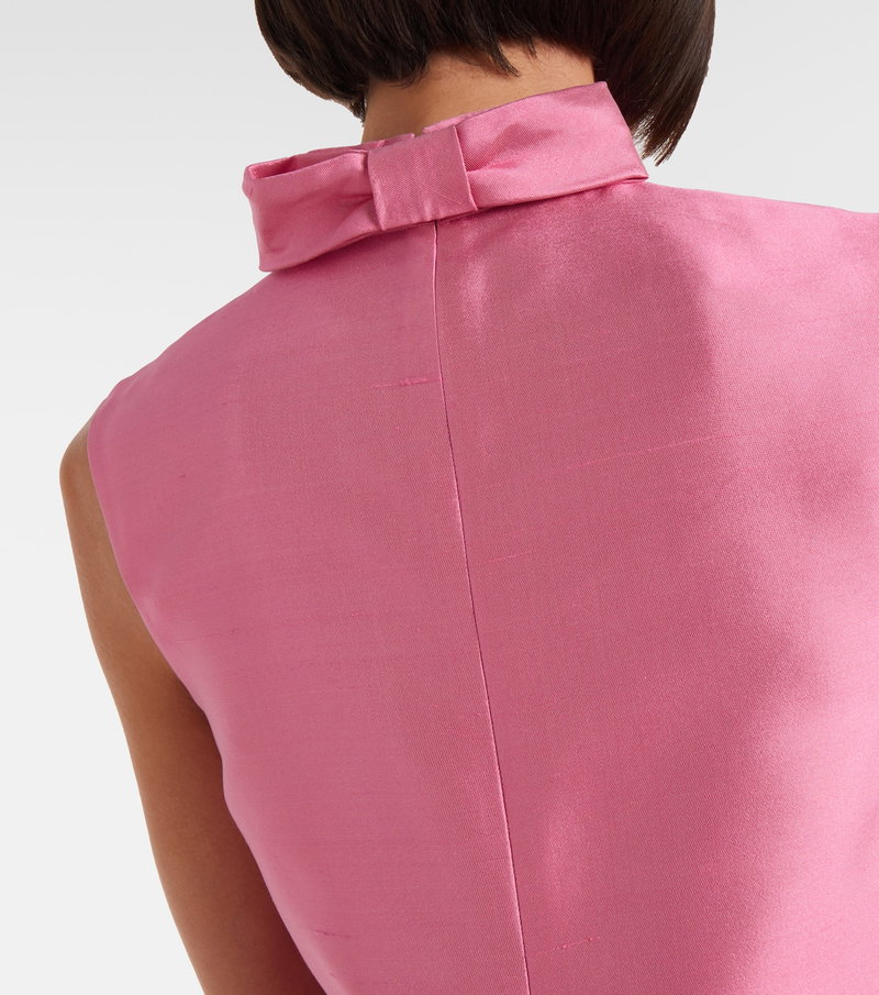 Pink satin blouse with a tied bow neckline
