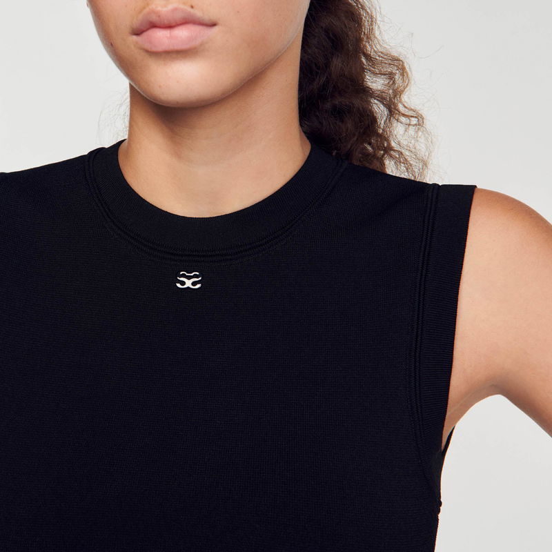 Black SANDRO sweatshirt with ribbed texture and logo detail.