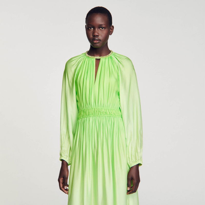Satin dress in bright green with a beaded neckline.