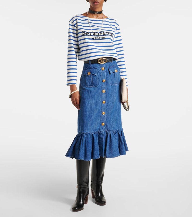 Striped top and denim skirt ensemble with accessories.