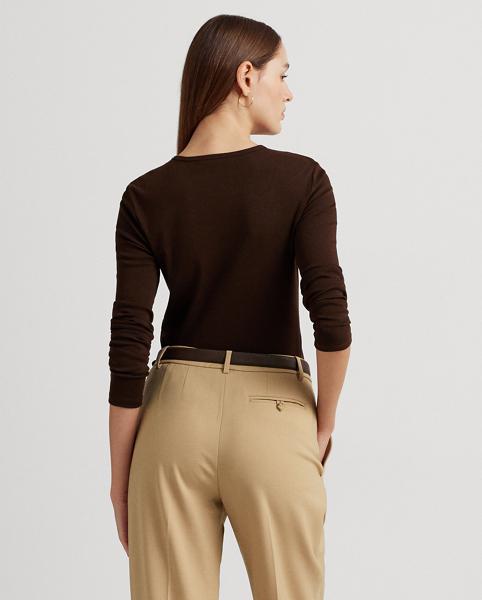 Brown long-sleeved top and beige trousers, viewed from behind.