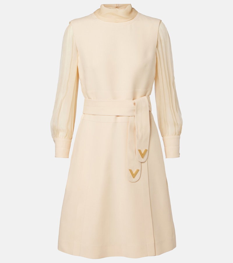 Cream-colored Valentino dress with long sleeves and a tie belt.