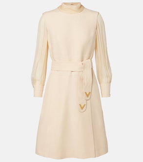 Cream-colored Valentino dress with long sleeves and a tie belt.