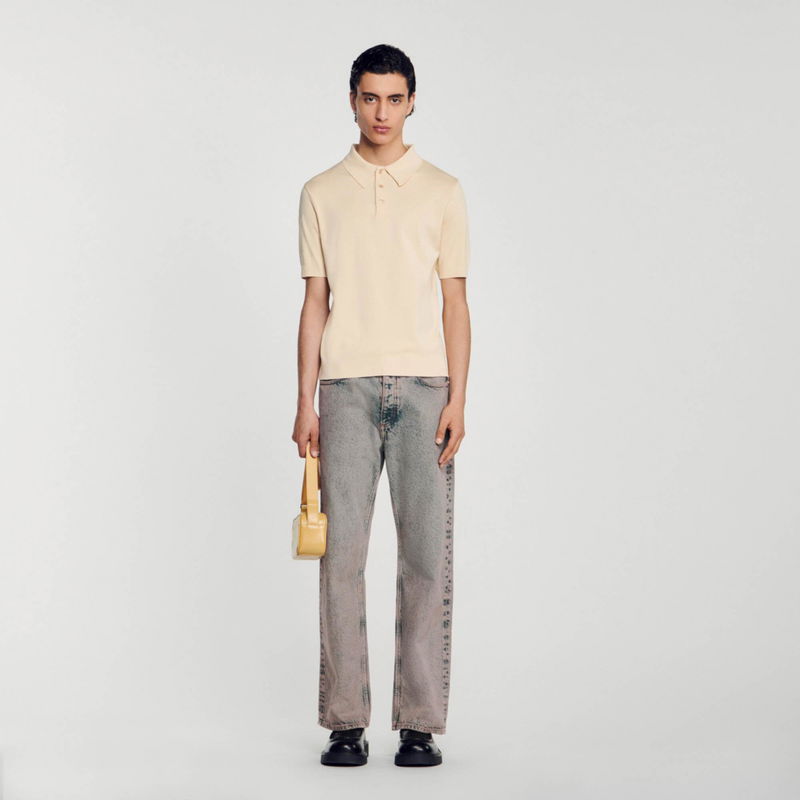 Sandro - Man in beige polo shirt and denim jeans