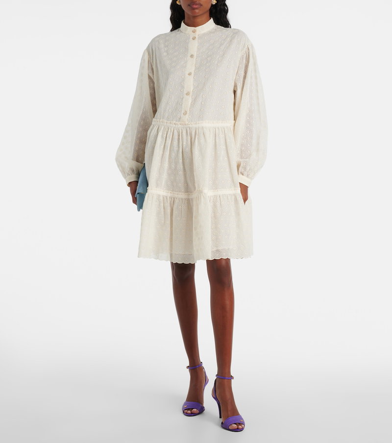 Valentino ivory eyelet dress with ruffled hem and sleeves.