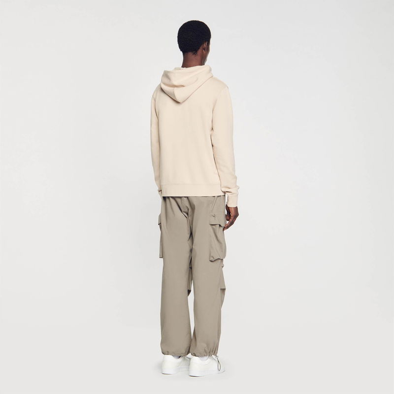 Sandro beige hooded sweatshirt and cargo pants outfit