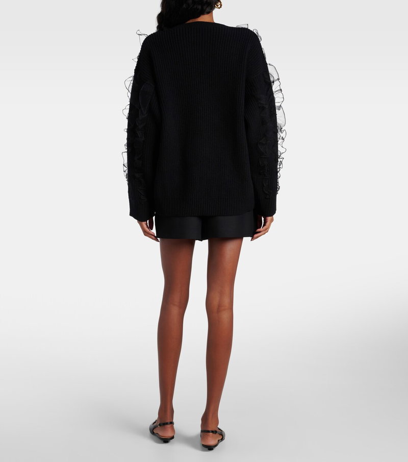 Valentino black cardigan with feather trim.
