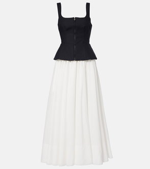 Black and white zippered corset top with a flowing white skirt.