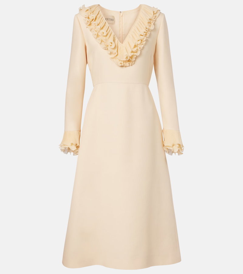Cream-colored dress with ruffled neckline and cuffs