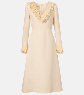 Cream-colored dress with ruffled neckline and cuffs