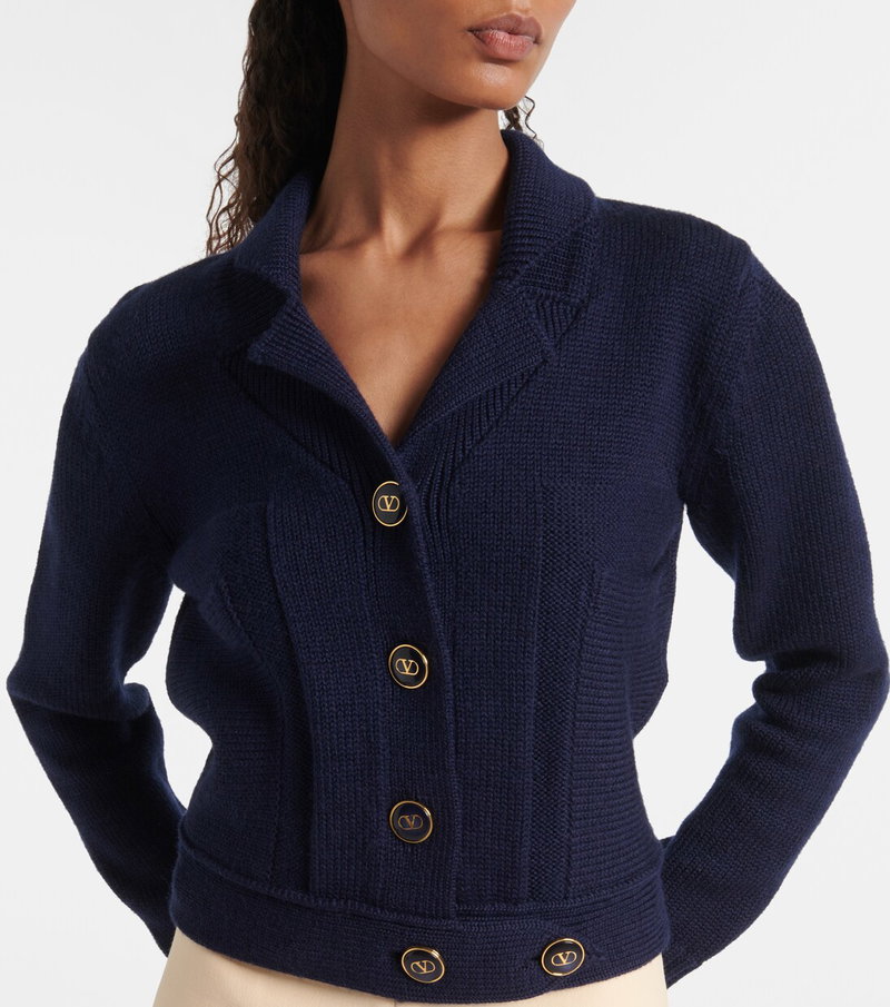 Navy Valentino cardigan with gold buttons and a V logo.