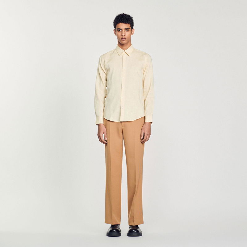 Sandro - Man in beige shirt and brown trousers