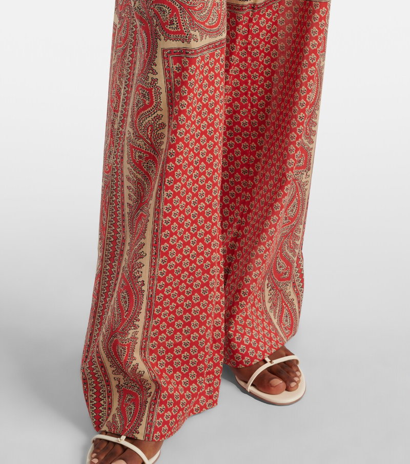Valentino wide-leg trousers with a red and beige paisley print.