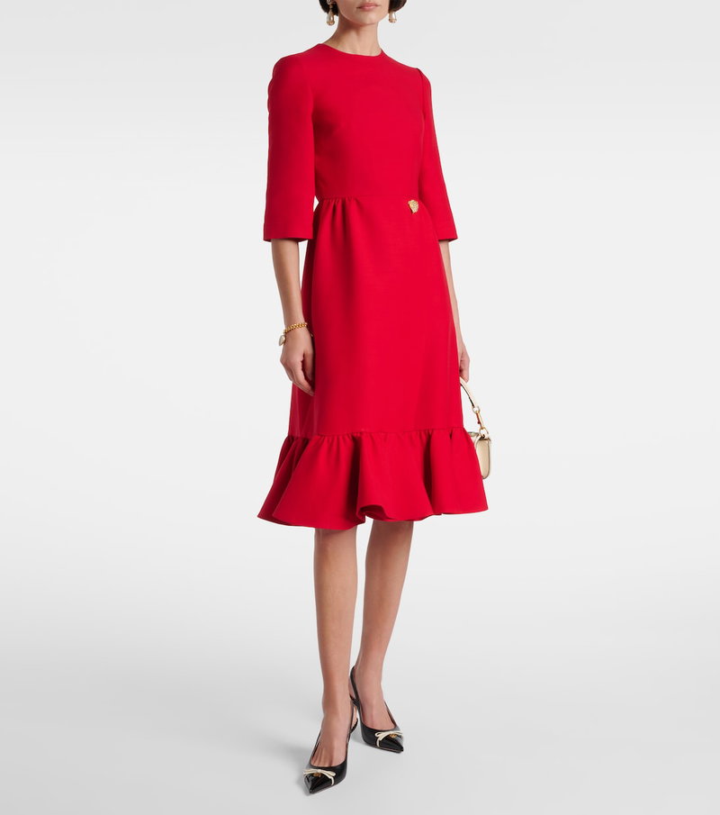 Valentino red midi dress with gold chain detail.