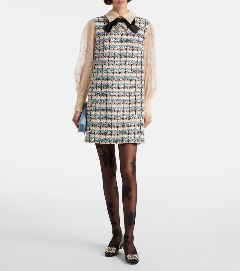Valentino tweed mini dress with embellished bow and sheer sleeves.