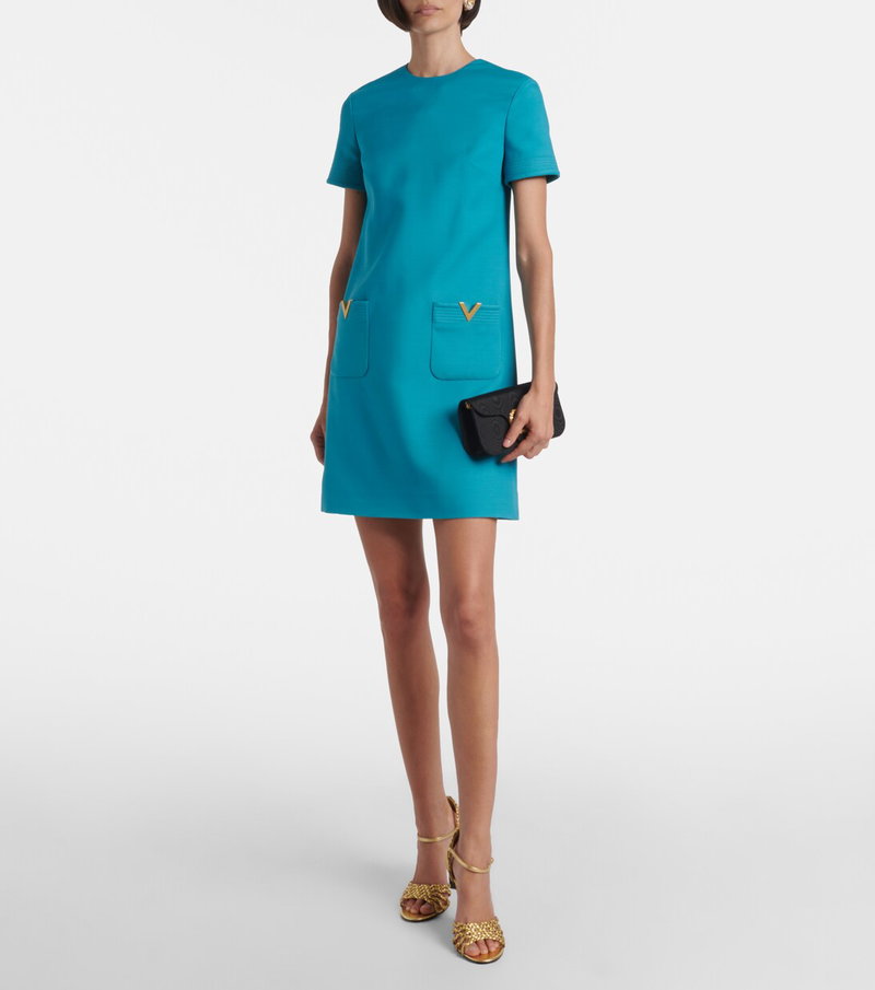 Valentino teal mini dress with gold detailing.