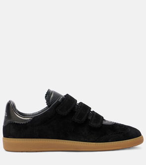 Black suede sneakers with velcro straps and gum sole.