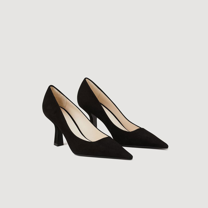 Black suede pumps with a pointed toe and stiletto heel.
