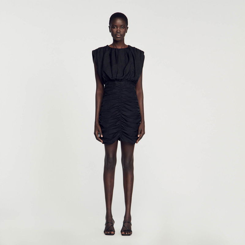 Black ruffled midi dress on a model