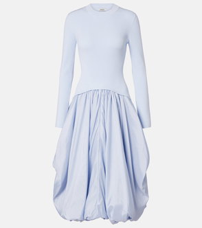 Light blue ribbed sweater dress with voluminous skirt.