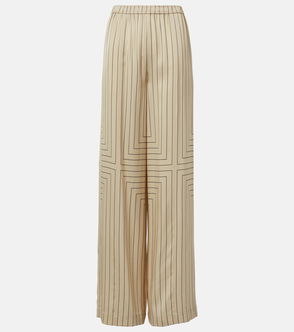 Cream-colored wide-leg trousers with vertical black pinstripes and a geometric pattern.