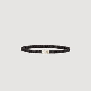Black leather bracelet with a gold embossed logo clasp.