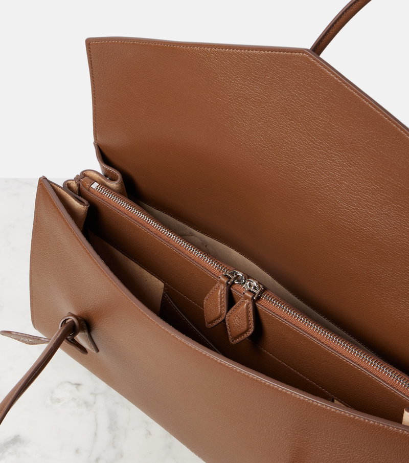 Brown leather tote bag, open with interior zipper pocket