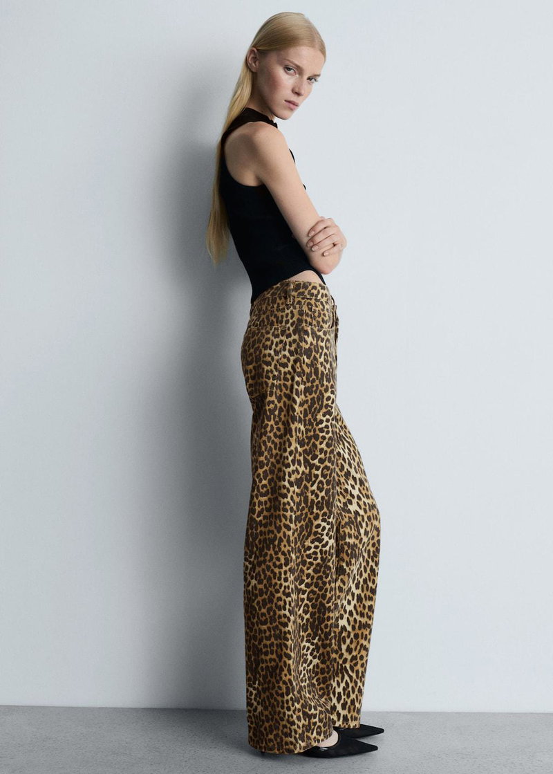 Woman in a leopard-print pant suit, MANGO