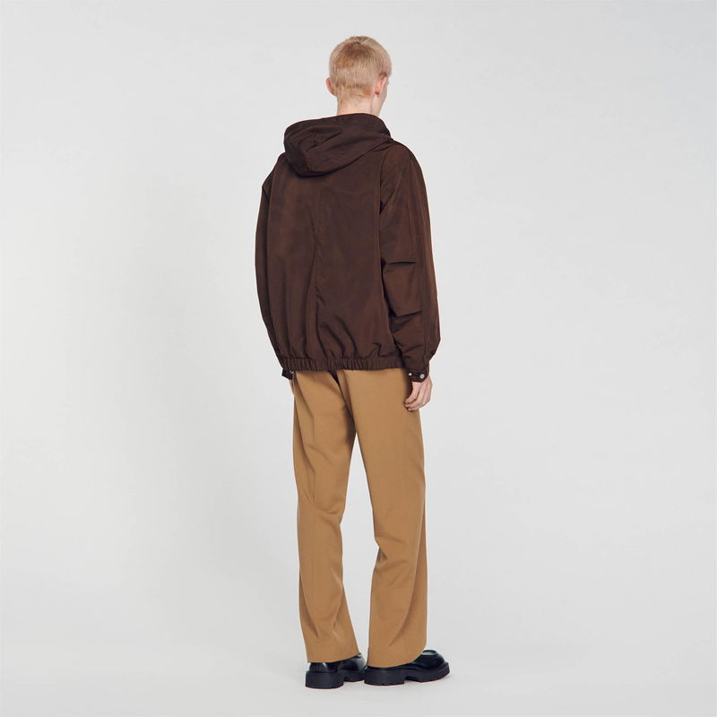 SANDRO brown hooded jacket with a man wearing it.