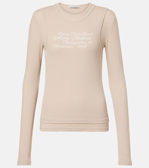 Beige ribbed long-sleeve shirt with embroidered text.
