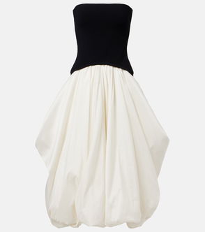 Black tube top with a voluminous, pleated skirt