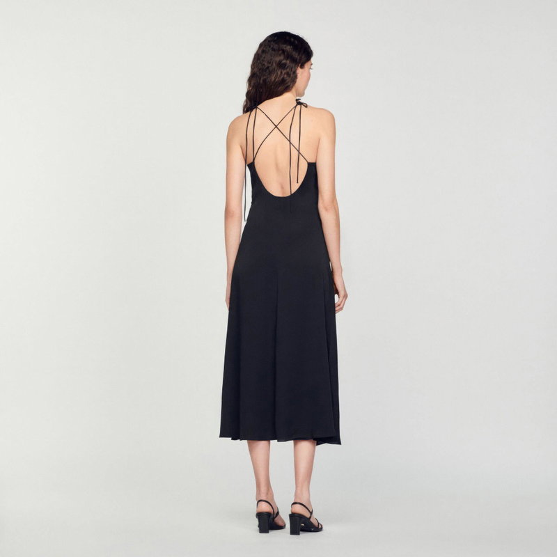Black midi dress with crisscross straps, backless design