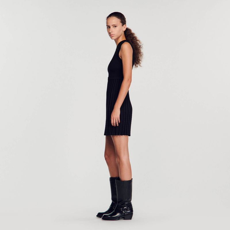 Black ribbed knit dress with boots