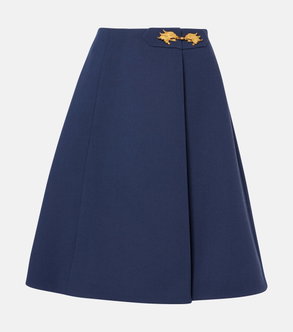 Navy pleated skirt with gold lion buckles