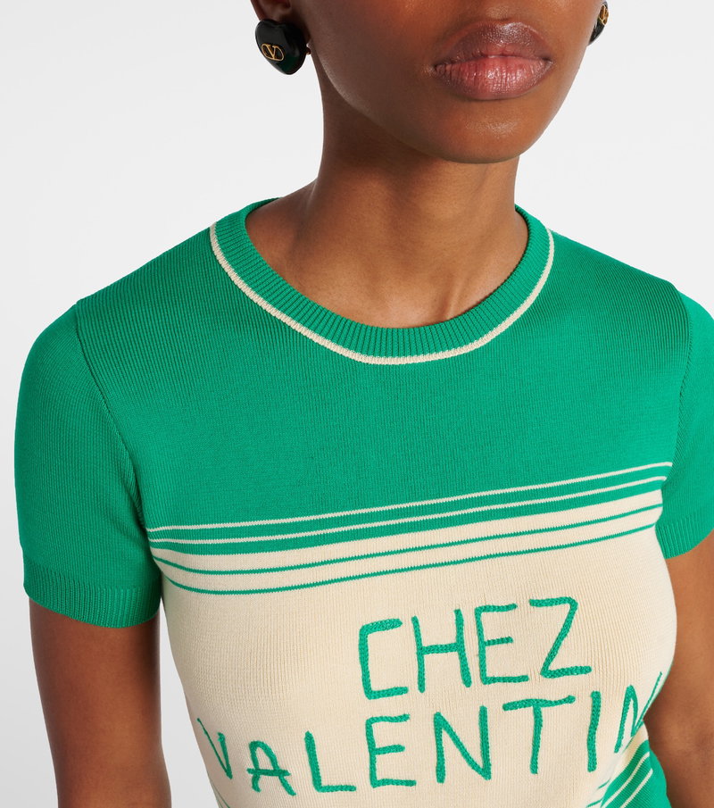 Valentino green knit top with white stripe and CHÈZ VALENTINO text.