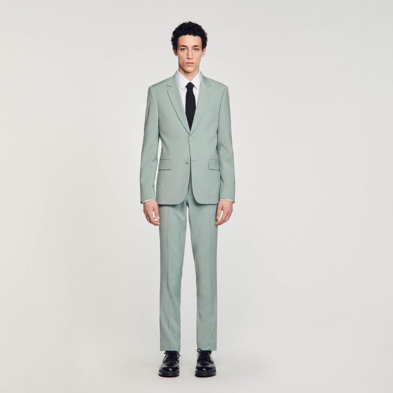 Man in light green suit and black shoes
