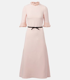 Pink ribbed dress with ruffled neckline and pleated sleeves.
