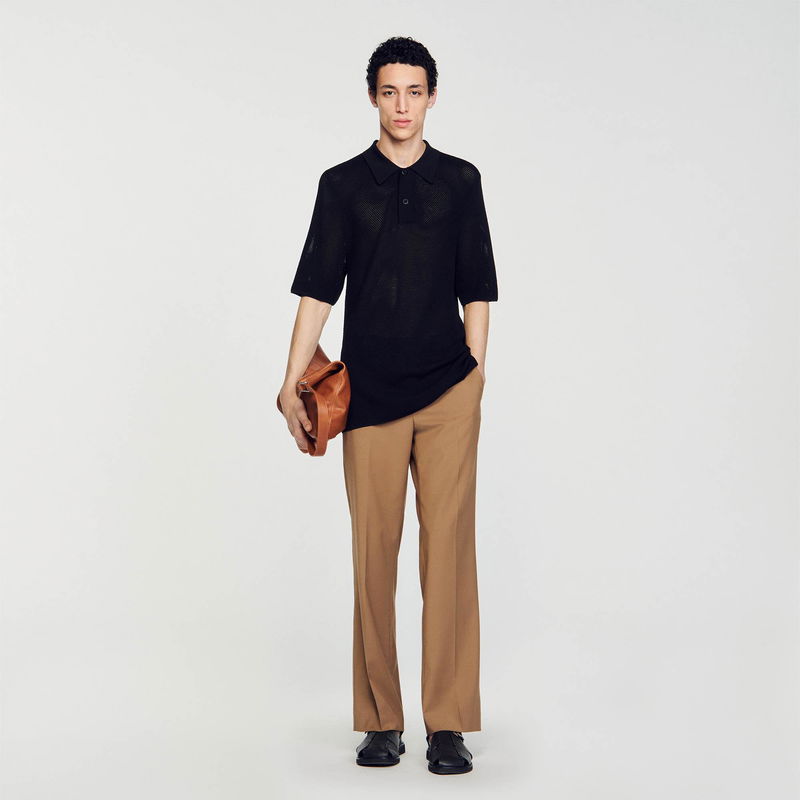 Black mesh polo shirt and tan trousers, SANDRO