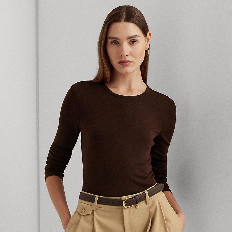 Brown crewneck sweater with a woman wearing it and a belt.