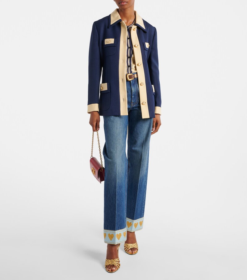Valentino navy and cream blazer with denim jeans and handbag