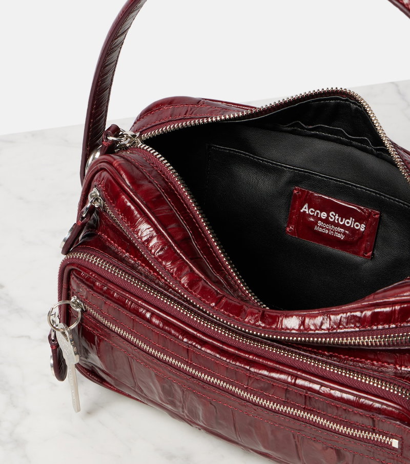 Red crocodile-textured leather shoulder bag with silver hardware.