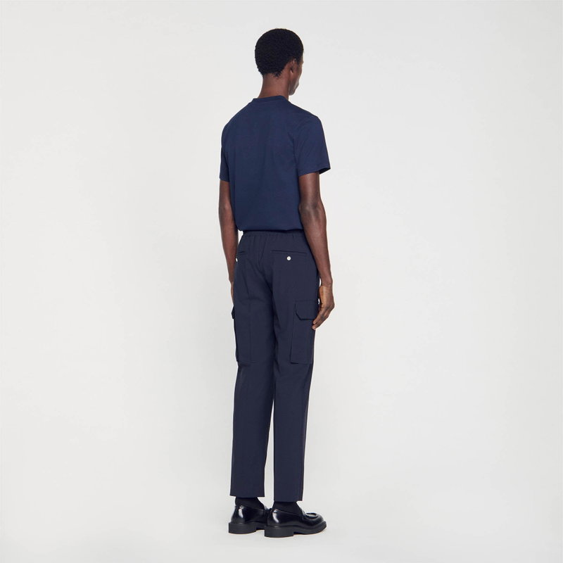 Dark navy trousers with pockets, worn by a man.