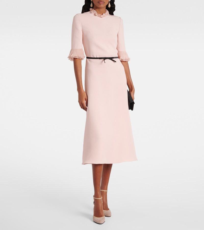 Pink midi dress with ruffled neckline and cuff sleeves.
