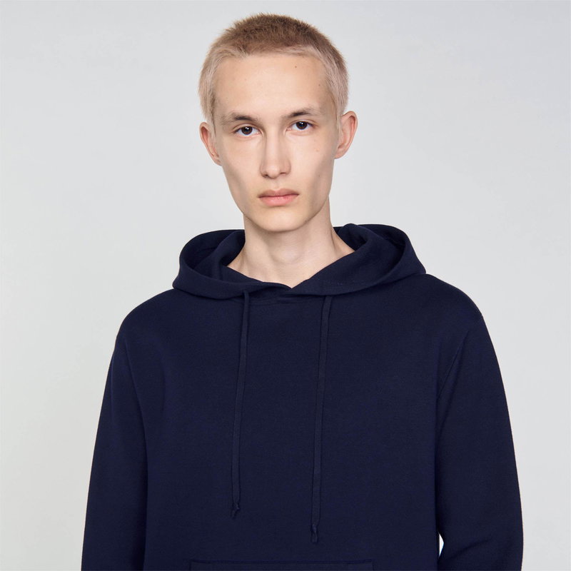 Sandro man in navy hooded sweatshirt