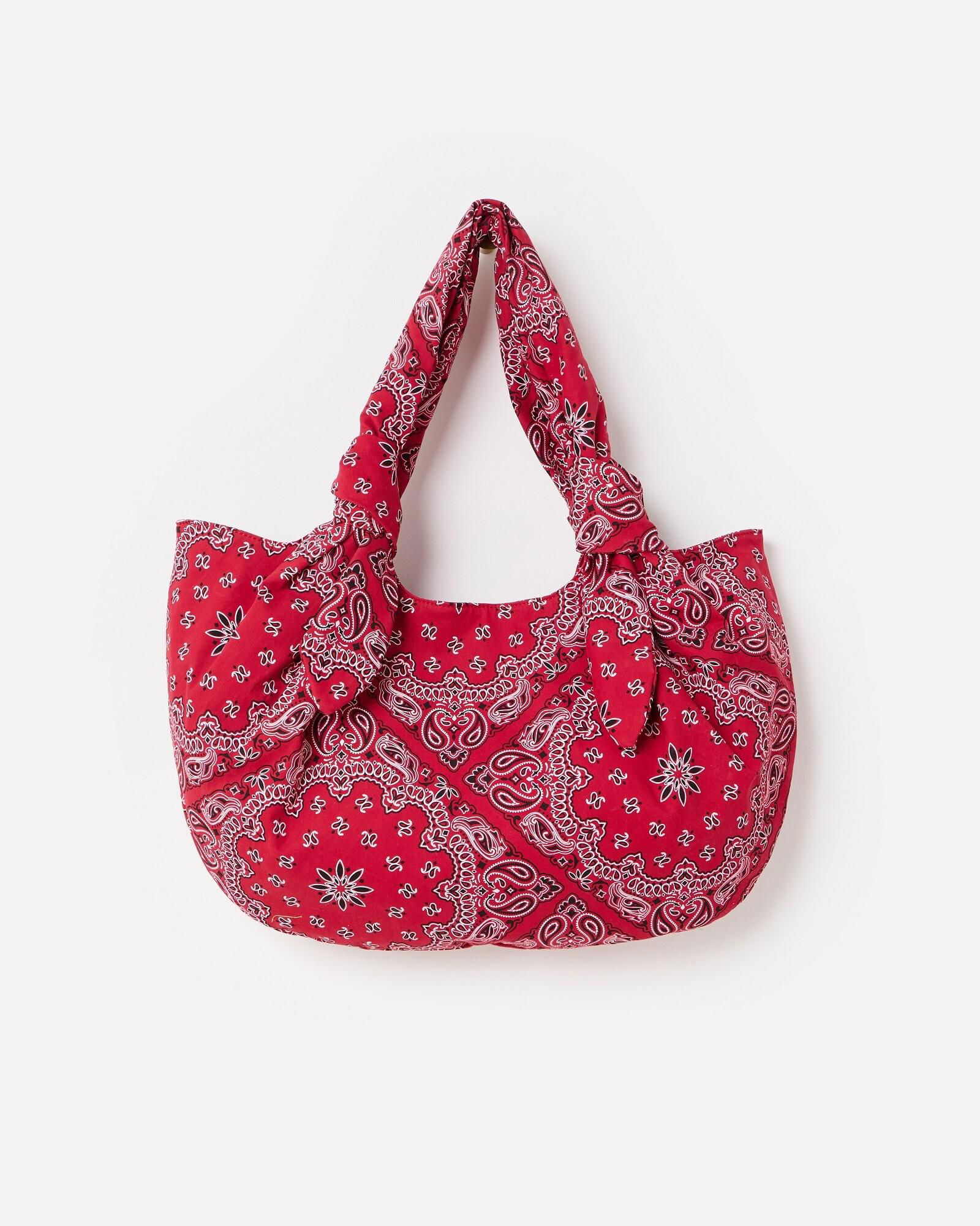 A red bandana print tote bag from OLIVER BONAS with a stylish design