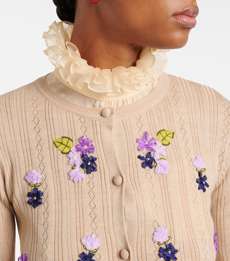 Valentino cardigan with floral embroidery and ruffled neckline.