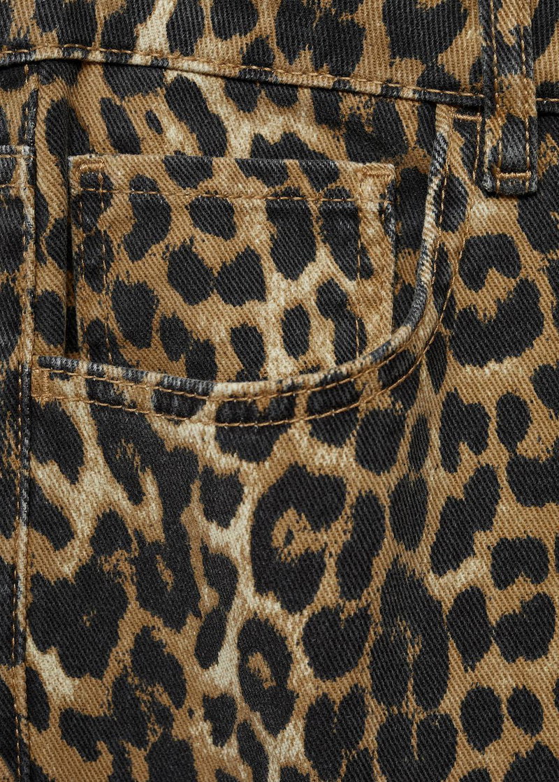 Leopard-print denim jeans, close-up detail