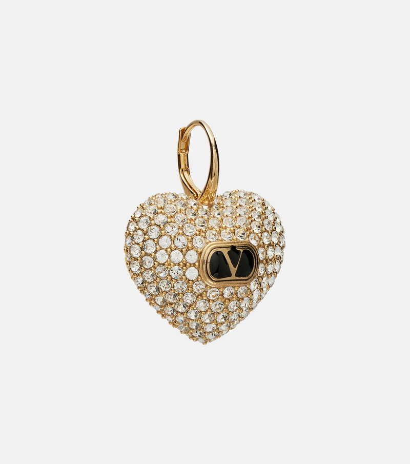 Gold heart-shaped earring adorned with crystals.