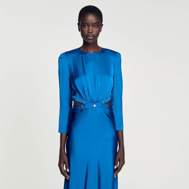 Blue satin dress with silver buttons and a draped neckline