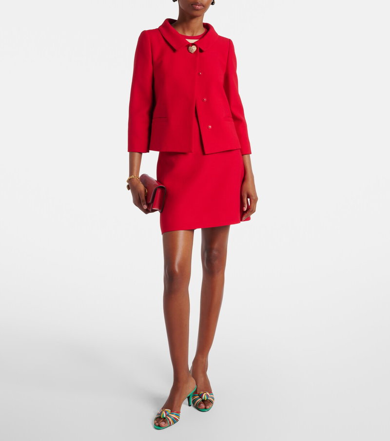 Valentino red suit with heart brooch and handbag